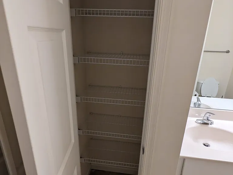 Second bathroom with linen closet