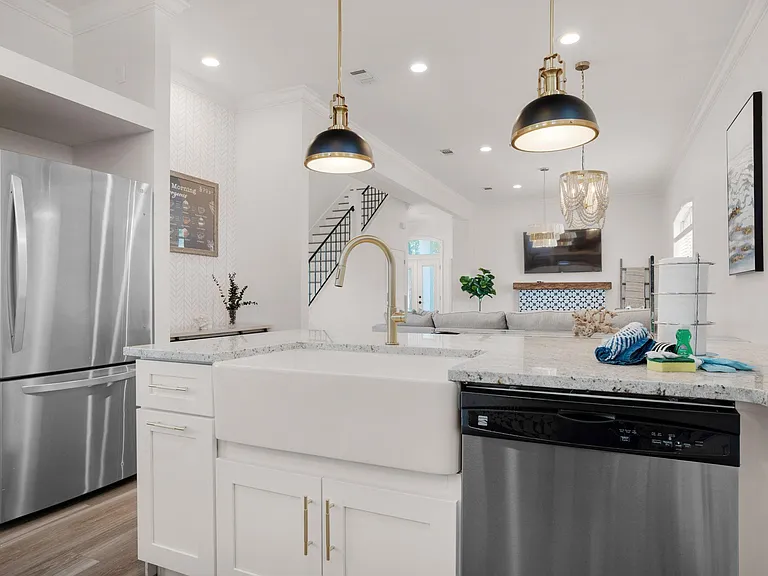 Kitchen peninsula looking into dining and living area