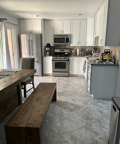 The kitchen has been freshly painted and beautifully remodeled.