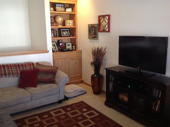 Living room showing custom built-in cabinets