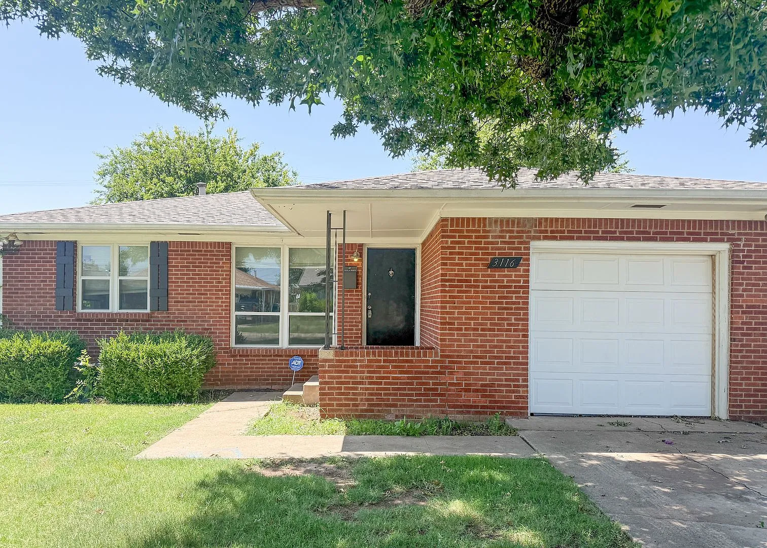 3116 NW 65th St | Hardwood Floors + Sunroom | NW OKC — Photo 1