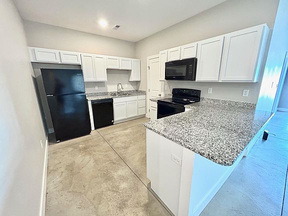 Kitchen complete with granite countertops