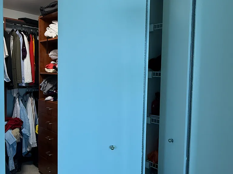 Lots of storage with pre-build cabinets and shelving