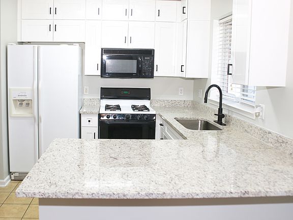 Remodeled kitchen with granite counter top and brand new cabinets.