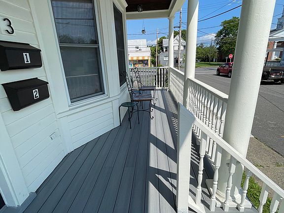 Rocking chair porch accessible to both apartments