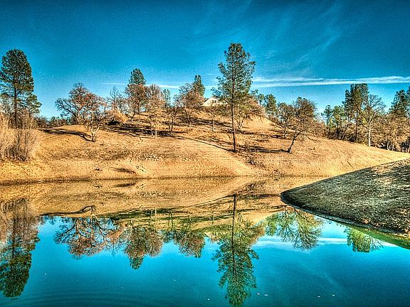 Two acreage stocked pond.