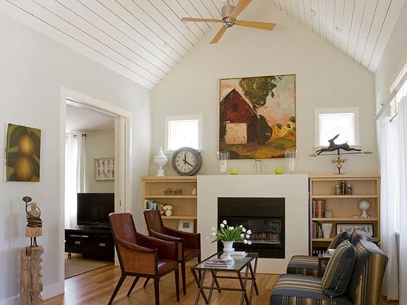 Cozy living room with vaulted ceiling and fireplace