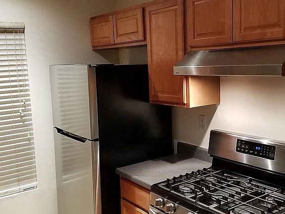 kitchen with new refrigerator and gas range