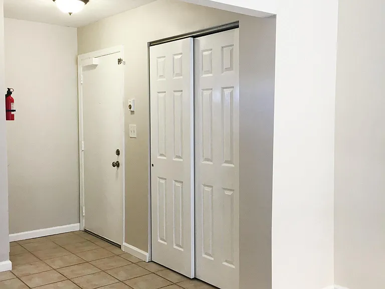 large coat closet in entryway.