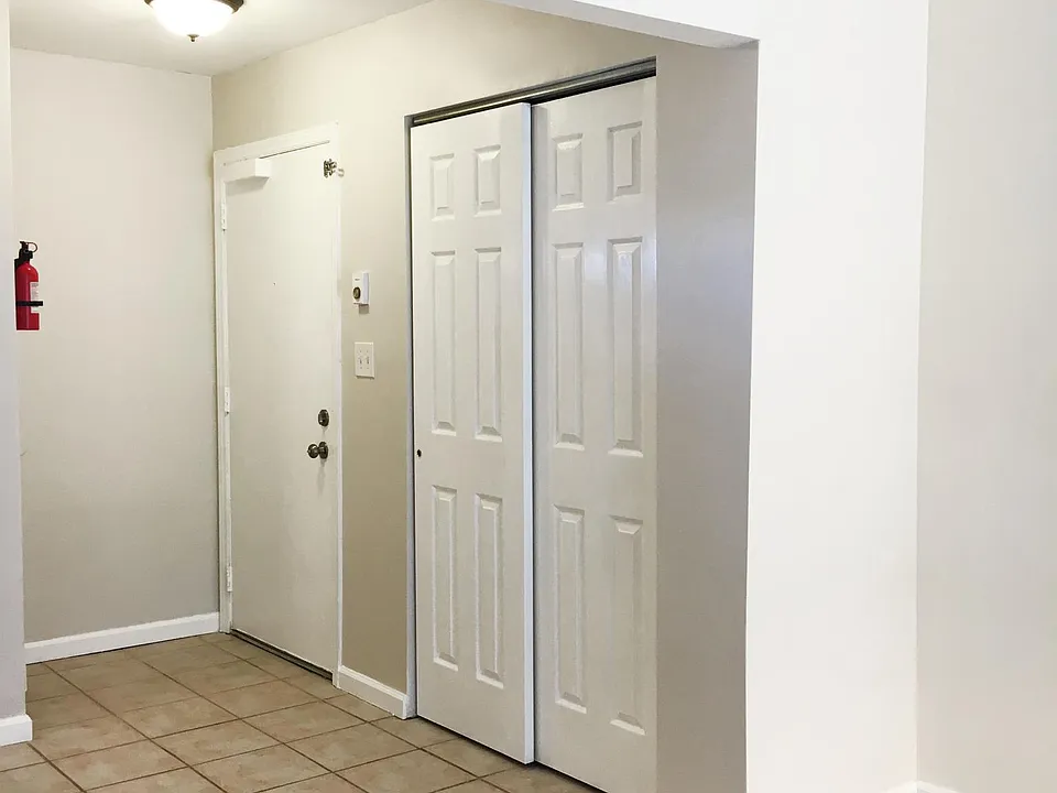 large coat closet in entryway.