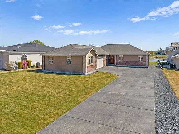 Flat usable yard with sprinkler system.  