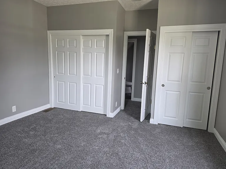 Different view of bedroom 2 with his and her closets
