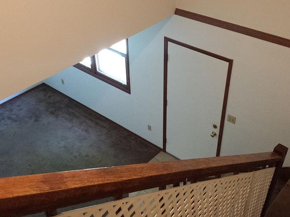 Looking down to the living room, partial vaulted ceiling