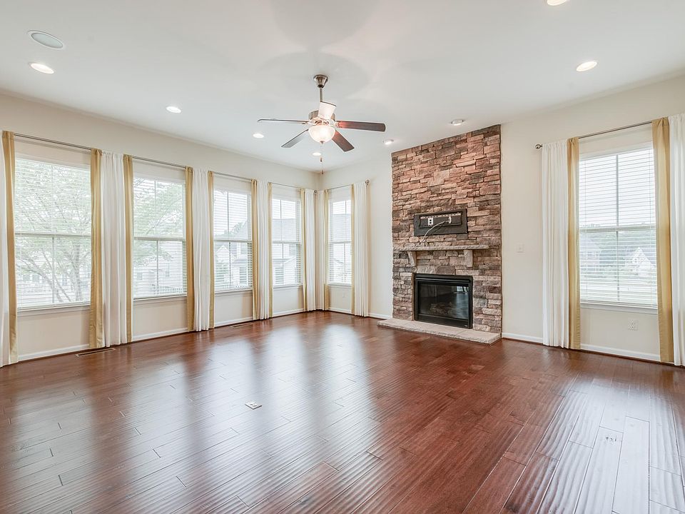 Family / Entertainment Room with Floor-to-Ceiling Stone and Gas Fireplace perfect for Gatherings