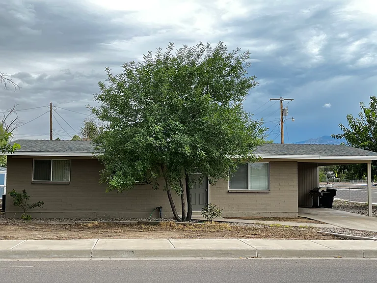 Front exterior of house with covered parking