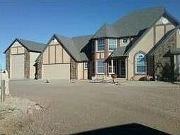 Custom Built : Large RV garage and a 2 car attached garage, lots of room for all the toys.