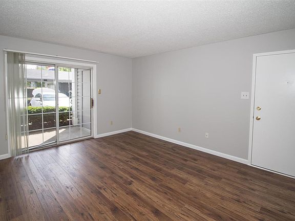 Newly installed flooring throughout the living rooms and bedrooms. Living room patio slider walks out to patio.