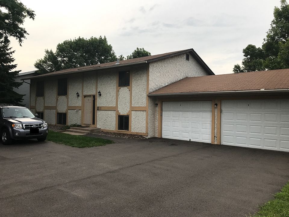 Front of property. Left Garage Stall is for upstairs unit. Additional driveway spots for up to 2 cars total.