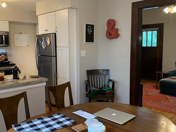 Open concept floor plan. Dining room opens to kitchen and living room