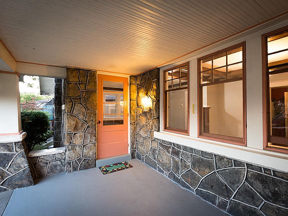 Lots of windows and lots of light streams into the dining room from the porch