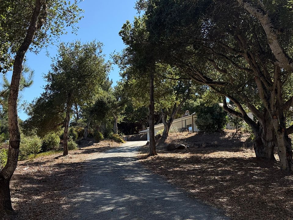 Private and exclusive driveway leads to secluded ranch with stunning views