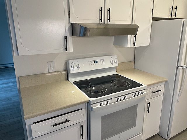 Glass top stove in kitchen