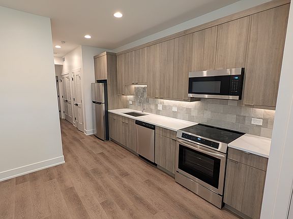 Front door, kitchen and living
