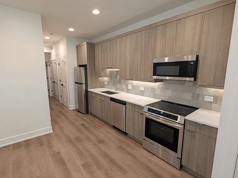 Front door, kitchen and living
