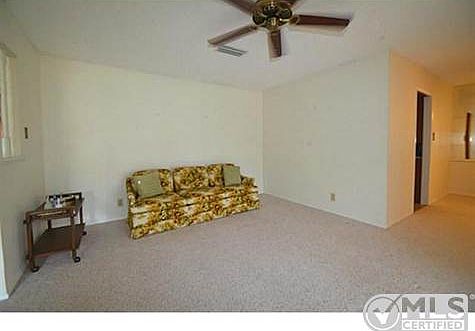 Formal Living Room with ceiling fan