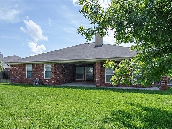 Brick on all 4 sides with nice covered patio in back