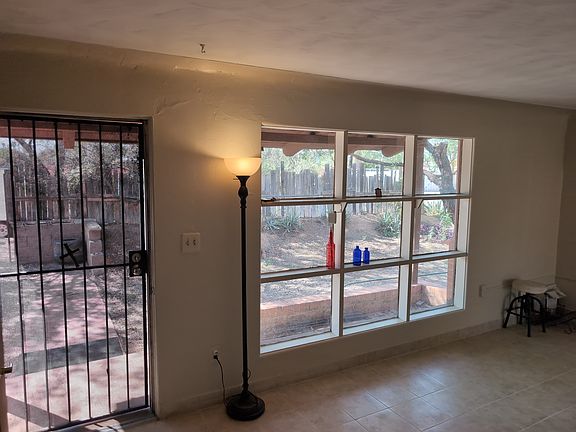 Living room, entrance to left. Large picture window.