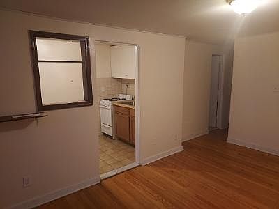 Living Room (looking into Kitchen and Bathroom to the right))