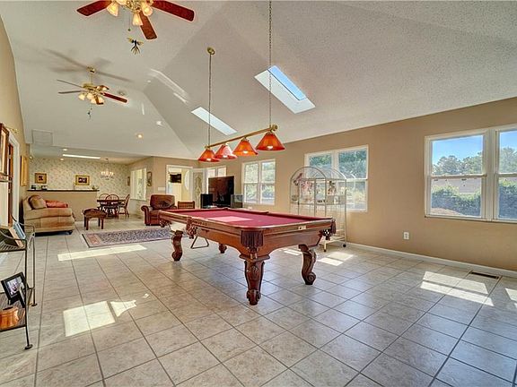 Grand family room with vaulted ceiling's and natural light