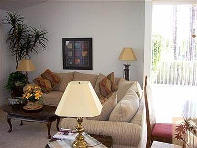 Another view of living room area. Slider opens to east pati