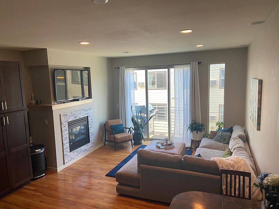 Living room and 2nd story deck with room for grill. Gas fireplace.