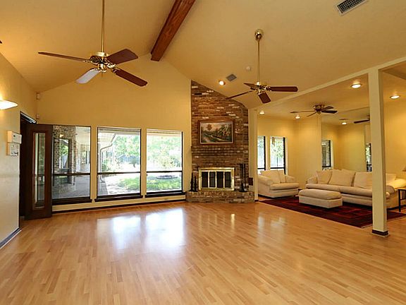 A swing room to match your lifestyle, could be a family room with fireplace and view of covered back