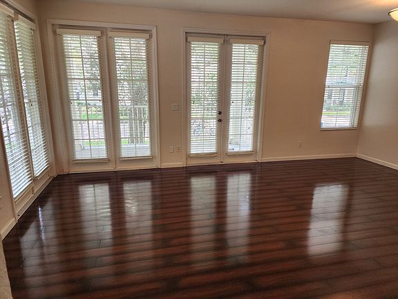 Great room view of the front door and windows.