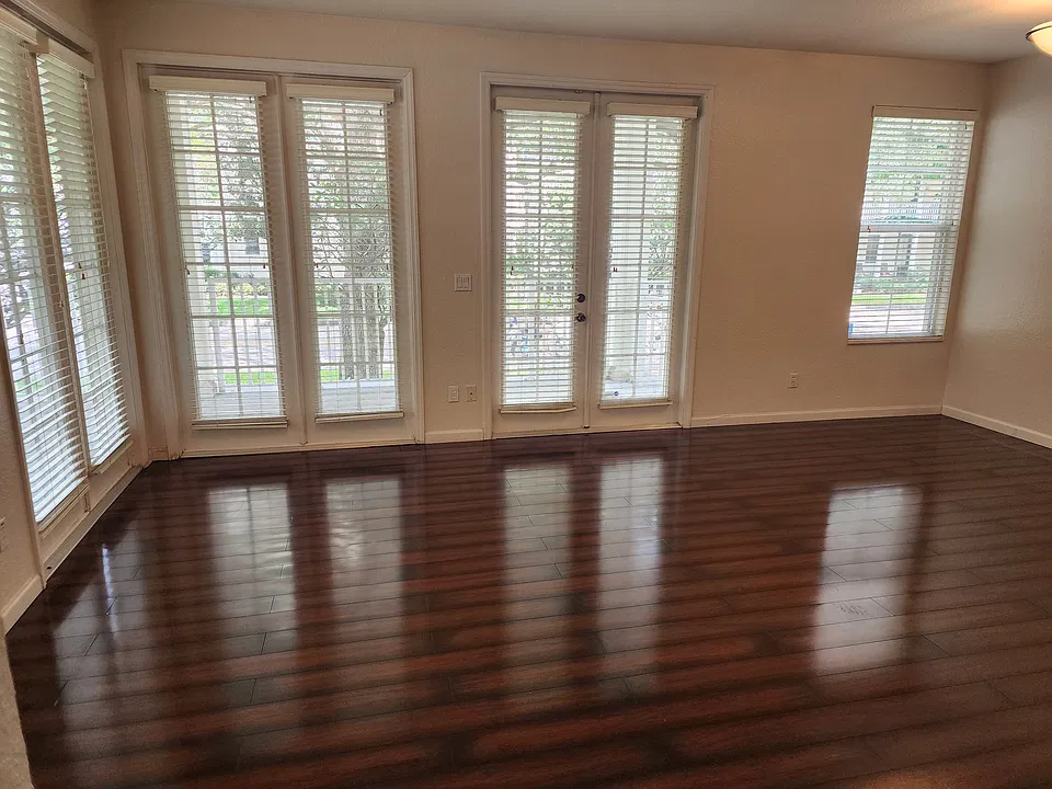 Great room view of the front door and windows.
