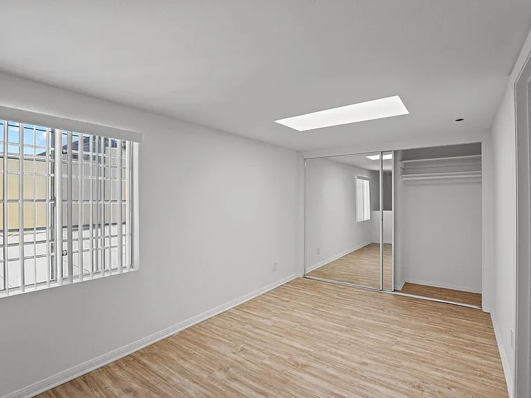 Bedroom with Mirrored Closet