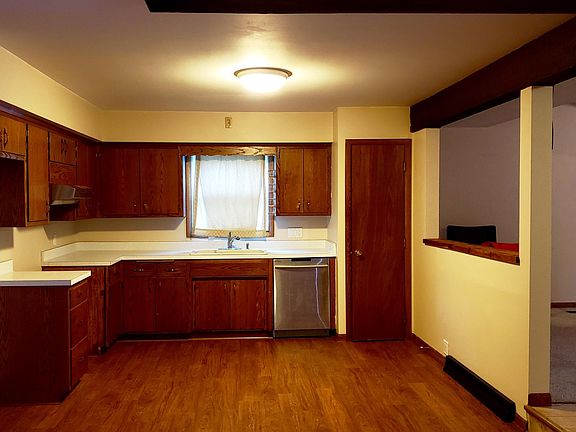 Eat-in Kitchen (appliances not included) with access to the carpeted family room.