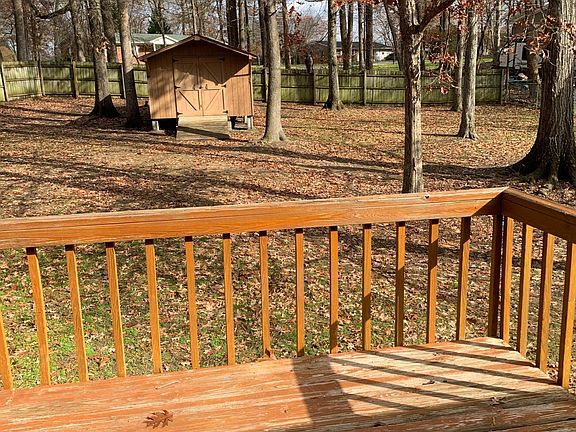 storage building, fence in back yard