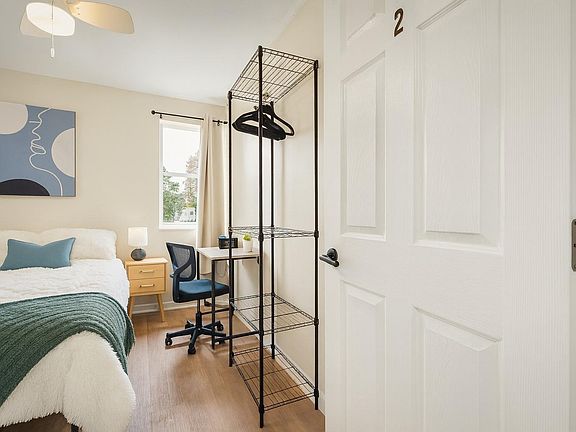 Cozy Corner full room with TV, dresser & natural light ideal for comfortable living in Jacksonville