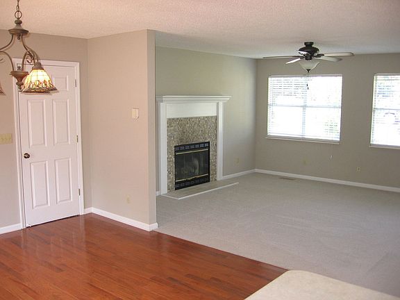 Open floor plan with custom fireplace
