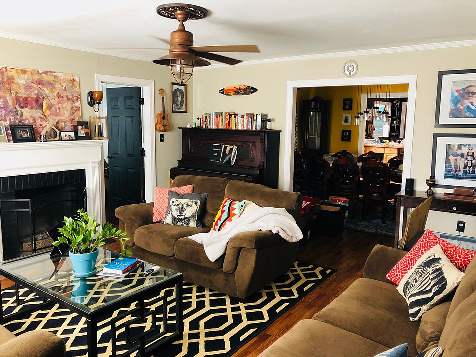 Living room with wood burning fireplace