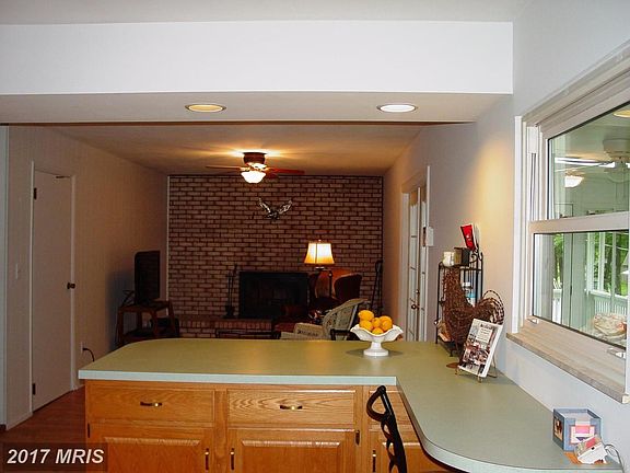 Kitchen to family room with wood burning fireplace