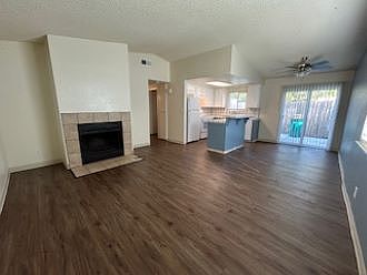 Living room, dining area, and kitchen from front door.