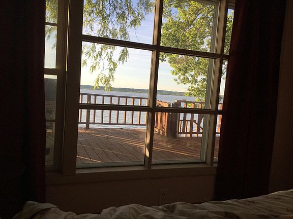 Taken from inside master bedroom overlooking deck and river. River view obtained also from living room and kitchen