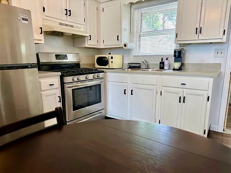 Kitchen appliances and window.