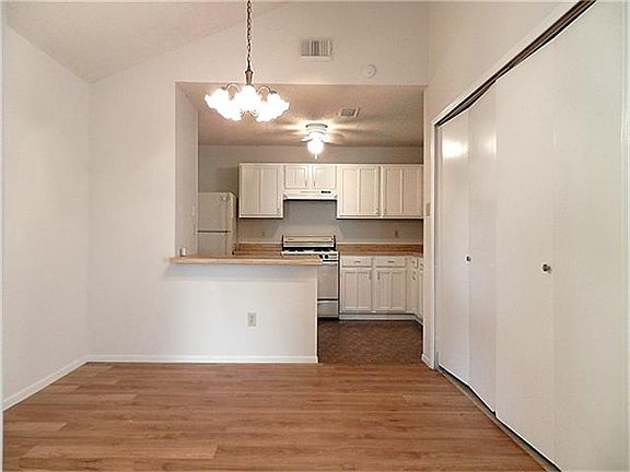 Just as you walk through the door and to your left - dining room and kitchen.