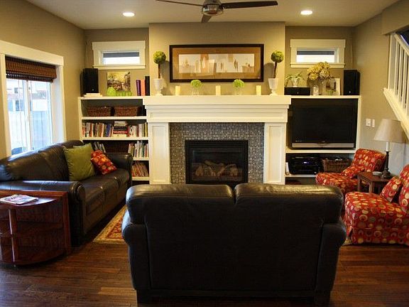 Family room with built in bookshelves, entertainment center and wired for surround sound. Heat-o-lat